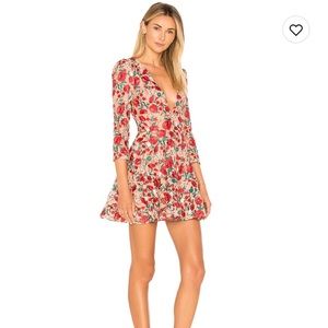 Plunging neckline dress is shaped by feminine floral crochet lace